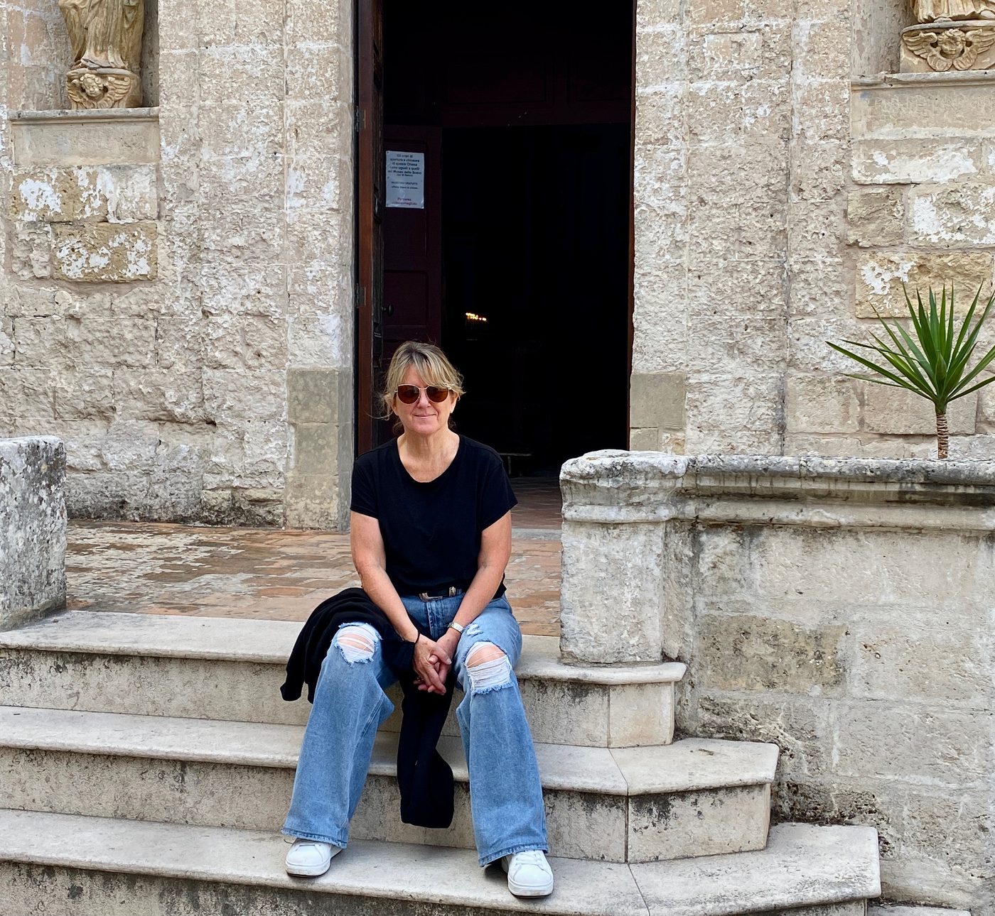 Jan Savolainen on the steps of a church in Puglia, Italy